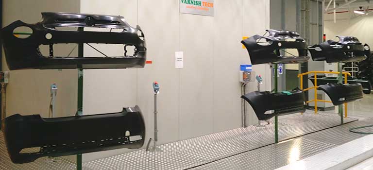 Automated car bumpers painting system. In detail, the carrier moves the raw bumpers to the washing area, and then delivers them to the robot to be flamed.